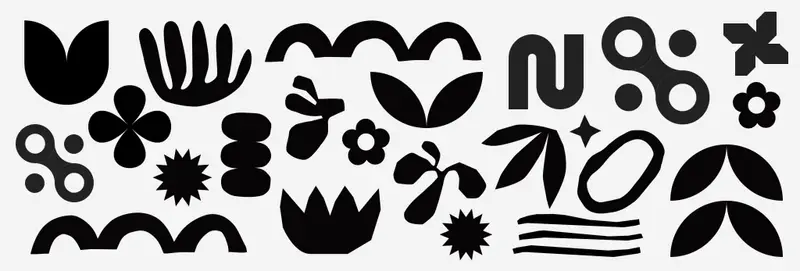 A variety of bold black-and-white abstract shapes, including circles, flowers, spirals, and leaf forms—designed for baby visual development.